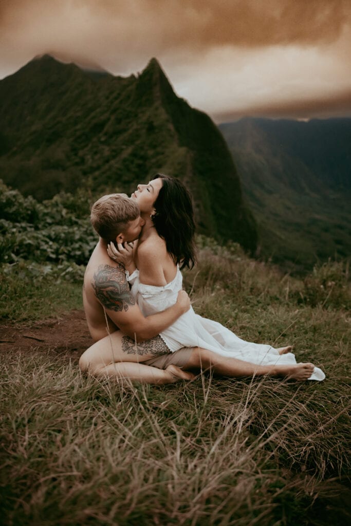 Photography Education, woman sitting in man's lap on a hillside